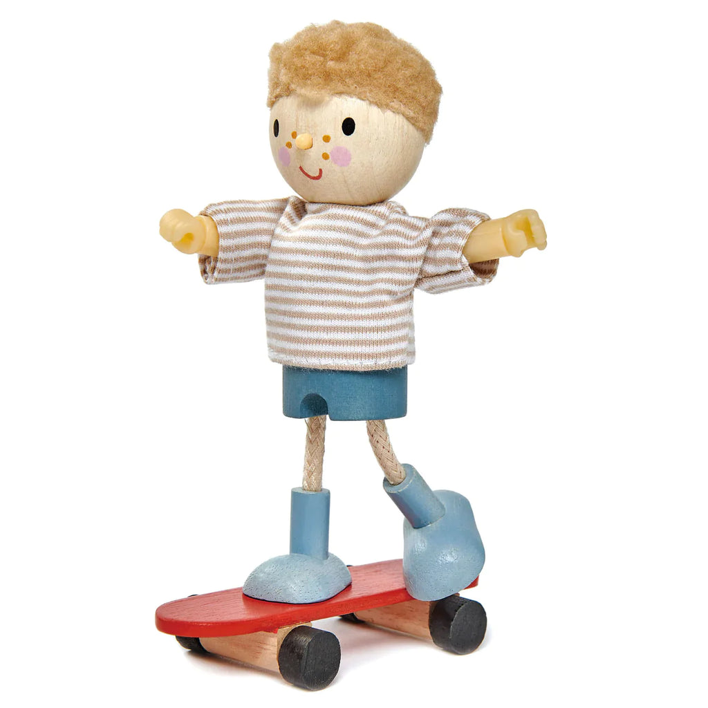 A wooden toy figure of Edward with his Skateboard, standing on a solid wood skateboard.