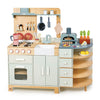 The La Fiamma Grand Kitchen is a charming wooden play kitchen set that includes a stove, oven, sink, hanging utensils, play food, and an adorable pizza oven toy. With shelves for storing toy fruits and vegetables, pastel colors, and rounded edges for safety, this inviting kids kitchen set inspires endless hours of imaginative play.