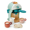 The Babyccino Maker is a wooden coffee toy shaped like a bird, complete with two colorful cup toys with faces, a milk pitcher, and two toy cookies—ideal for your child’s pretend café play.
