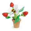 A toy wooden Strawberry Flower Pot, featuring white petals with a magnetic bumblebee in the center, surrounded by green leaves and three red ladybugs.