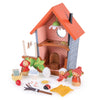 Robin's Nest Box is a colorful wooden dollhouse with a red roof, polka dot wallpaper, three dolls, charming accessories like a broom, egg, leaf bed, insects, and household items—perfect for imaginative play and storytelling.