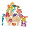 A colorful wooden stacking toy featuring sea creatures such as a seahorse, fish, coral, and starfish, creatively arranged to fit within a frame shaped like ocean waves and seabed - Stacking Coral Reef.