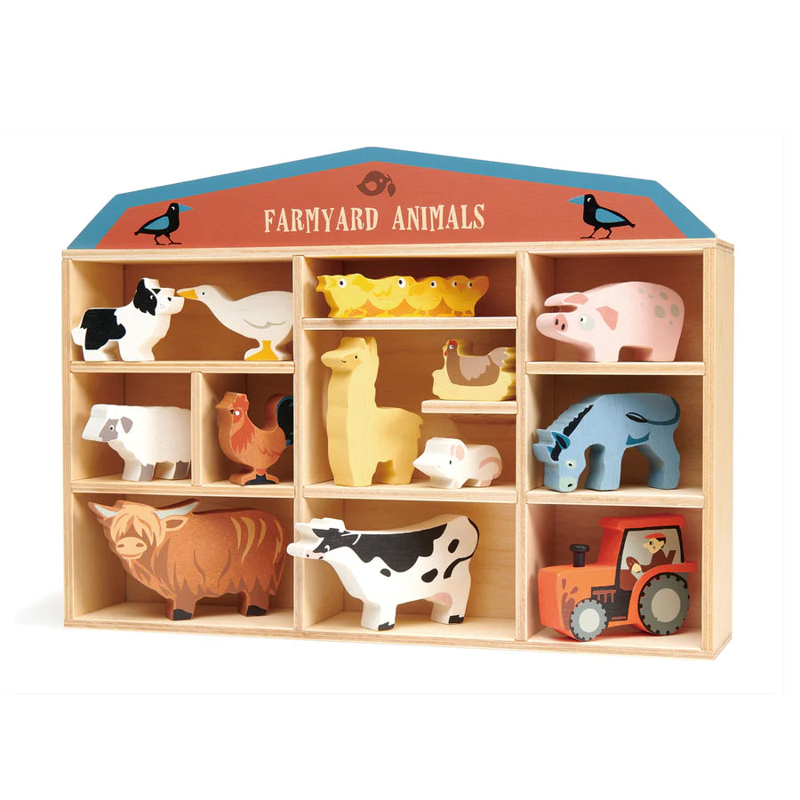 A wooden toy shelf displaying the Farmyard Animals Set, which includes assorted animal figures like cows, pigs, sheep, chickens, and a tractor, all made from sustainably sourced rubberwood, set against a plain.
