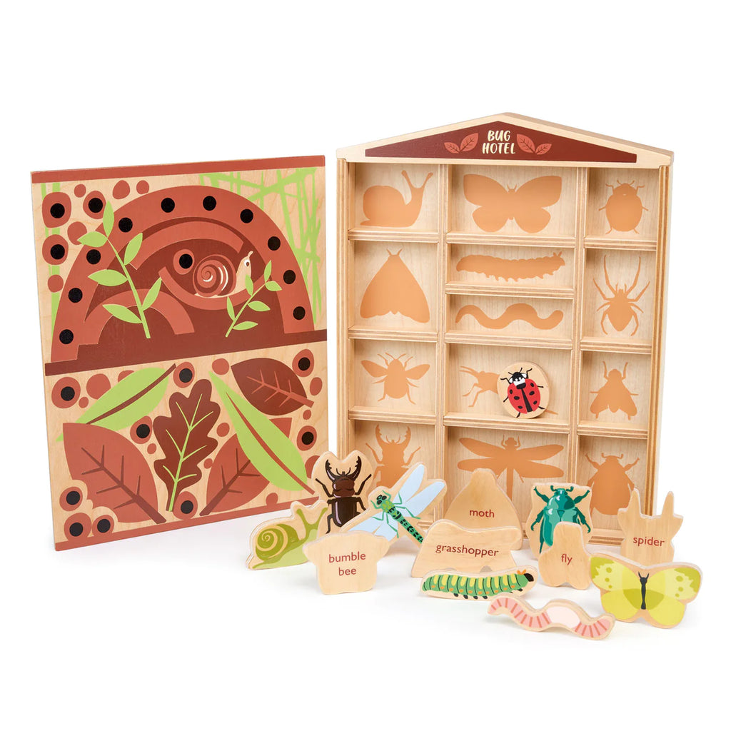 A children's educational toy featuring The Bug Hotel with compartments containing model garden bugs like a bumblebee, grasshopper, moth, fly, and spider, alongside an illustrated book.