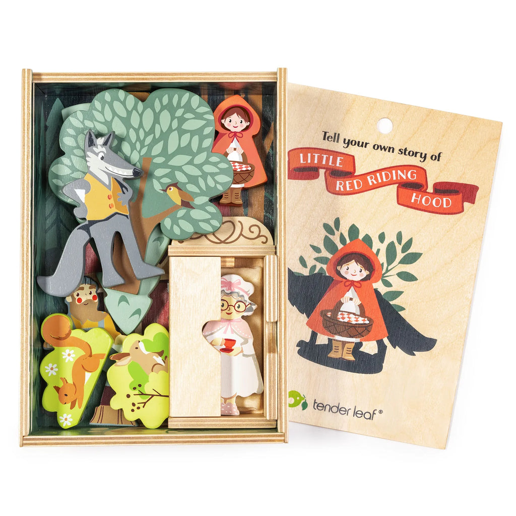 The "Your Story of Little Red Riding Hood" set includes wooden figures—Red Riding Hood, the wolf, grandma, a tree, and a house—in a plywood box for imaginative woodland storytelling.