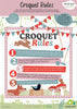 The "Woodland Indoor Croquet Set" includes an illustrated poster titled "Croquet Rules," featuring colorful, playful designs. It outlines five rules with a rabbit illustration holding croquet mallets under a banner, set against striped and polka dot backgrounds.