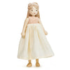 A handcrafted Ferne Wooden Doll with a gentle expression, wearing a white flowing dress and a peach top, standing upright against a plain white background.