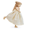 A handcrafted Ferne Wooden Doll with braided hair, wearing a flowing beige dress and depicted mid-twirl, isolated on a white background.