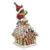 The Wee Forest Folk Tiny Collectible - Santa's Gingerbread House features a hand-sculpted mouse in a Santa outfit with a candy cane, standing atop the snowy chimney of a decorated gingerbread house with icing and candy details.