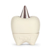 A Konges Sløjd Stone Tooth Box crafted from ceramic with a metallic, cone-shaped protrusion on top resembling a tooth's root. The lower part features an embossed logo and text. Perfect for a child's first teeth, the container has a smooth, sleek finish and minimalist design.