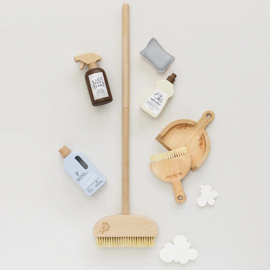 A flat lay showcasing the Pretend Play Cleaning Set with FSC-certified wood tools, including a broom, brushes, spray bottles, and cloud-shaped sponges, all neatly arranged on a light background.