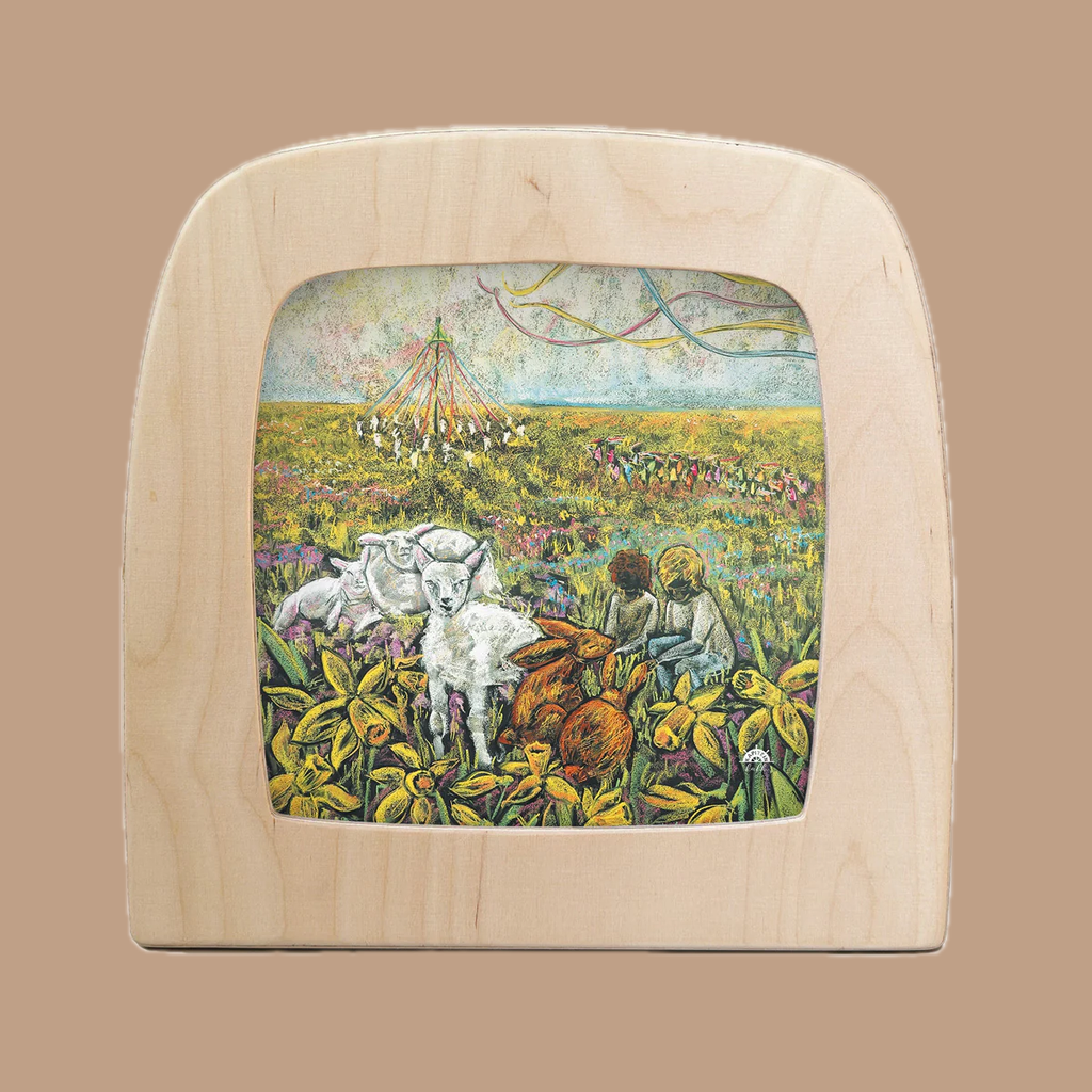 The Silhouette Only - Spring Time for Toverlux Lamp features a wooden frame with translucent material showcasing a vibrant spring meadow scene, children by a maypole, and playful animals like lambs and rabbits amid yellow flowers, perfect for a cozy home atmosphere.