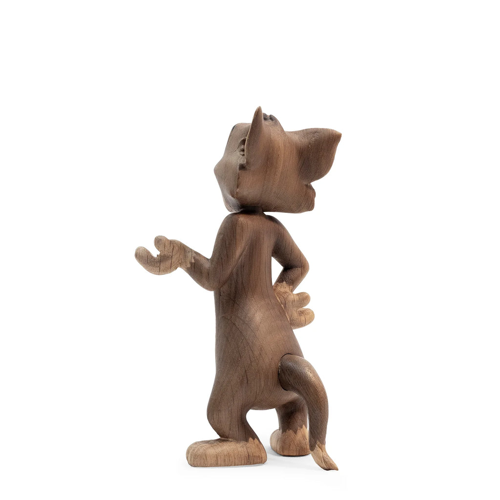 The Boyhood Tom & Jerry X Tom, Small is a solid oak figurine of Tom standing upright with one arm raised and the other on his hip—a charming gift for fans, shown against a plain white background.