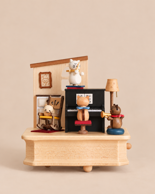A Wooden Cat Playing Piano Music Box featuring a miniature scene of four cat figurines playing musical instruments inside a cozy living room.
