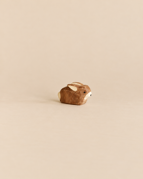 Handcrafted wooden Ostheimer Small Rabbit figurine in a sitting position.