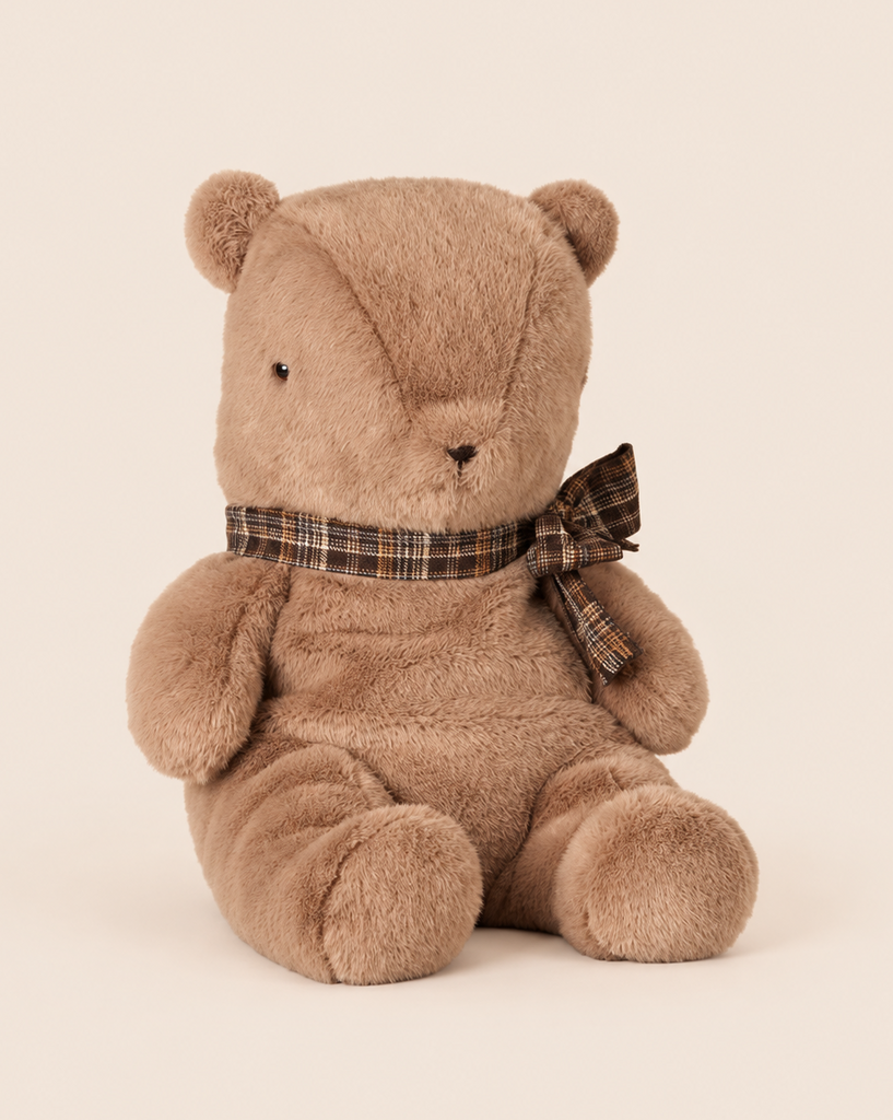 Maileg Teddy Bear Plush, Large - Dark Mushroom, a soft, dark mushroom brown plush teddy bear wearing a plaid ribbon tied in a bow around its neck.