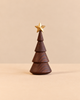 Spring Copenhagen The Christmas Tree in thermo beech is a stylized, tiered wooden tree topped with a small gold star.