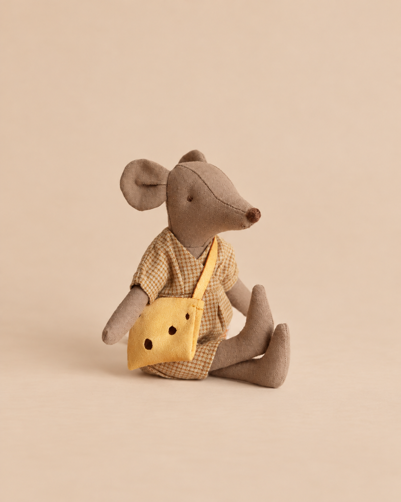 A Maileg Mum Mouse In Checkered Dress - Light Brown wears a yellow crossbody bag.