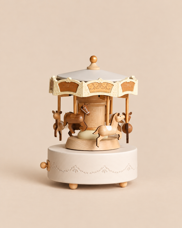Wooden Carousel Music Box with miniature horses, featuring a cream-colored base and canopy with gold-tone decorative details.