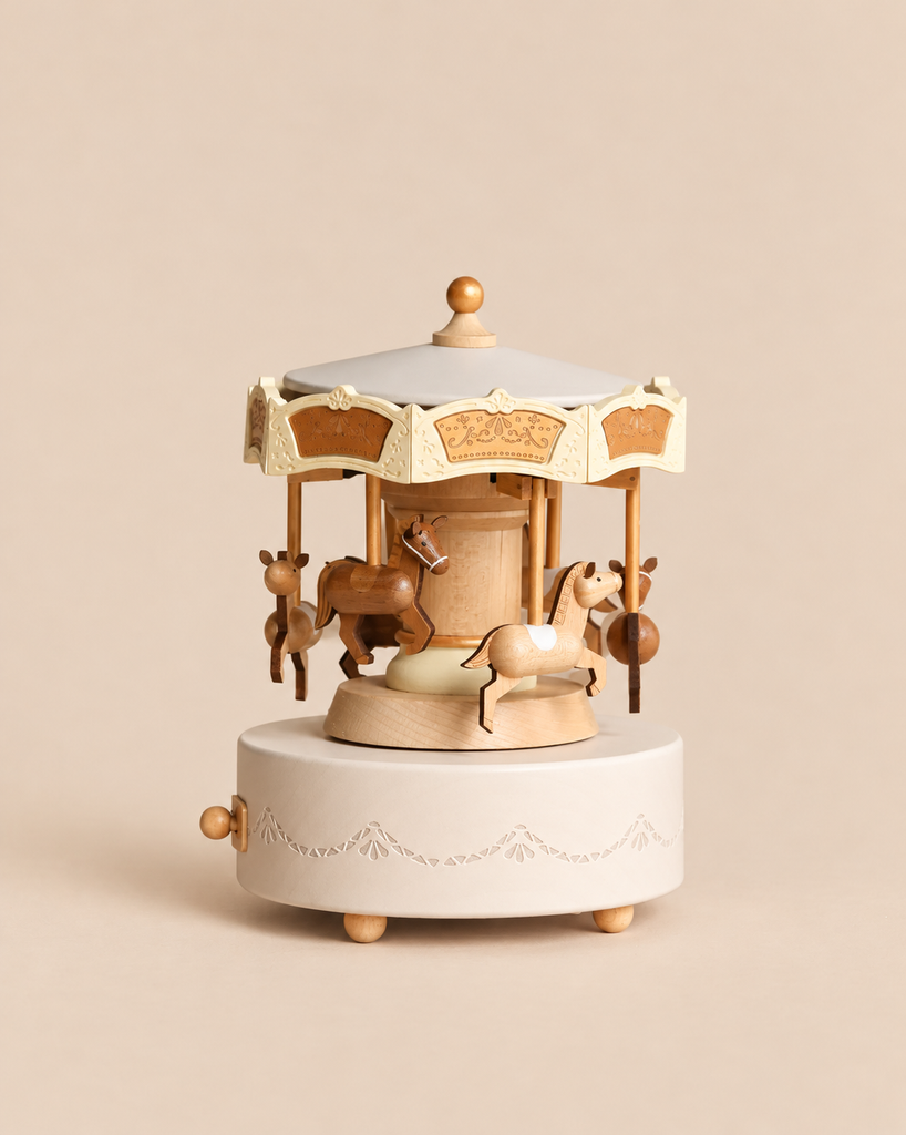 Wooden Carousel Music Box with miniature horses, featuring a cream-colored base and canopy with gold-tone decorative details.