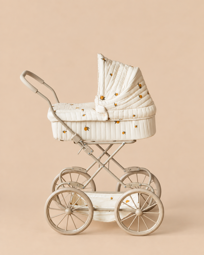 Konges Sloejd Doll Pram - Lemon in cream with a yellow lemon print and large wheels.