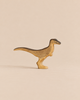 Handmade Holzwald Dinosaur - Velociraptor toy in shades of tan and dark brown, perfect for sustainable imaginative play.