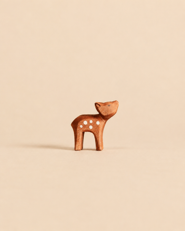 Ostheimer Deer - Small, Head High handcrafted wooden deer figurine with white spots and its head tilted upward.
