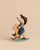 A Maileg Cowboy Mouse on Rocking Horse, Little Brother sits on a small wooden rocking horse.
