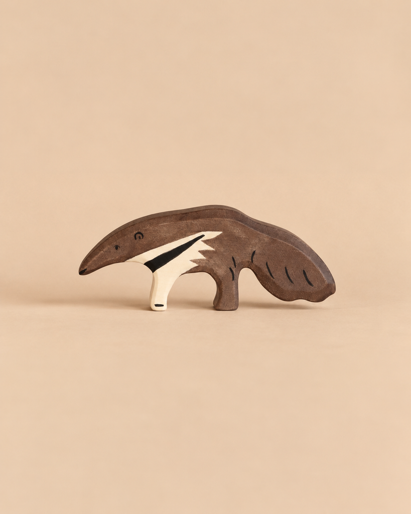 Holztiger Anteater handcrafted wooden toy with dark brown fur and a white stripe along its side.