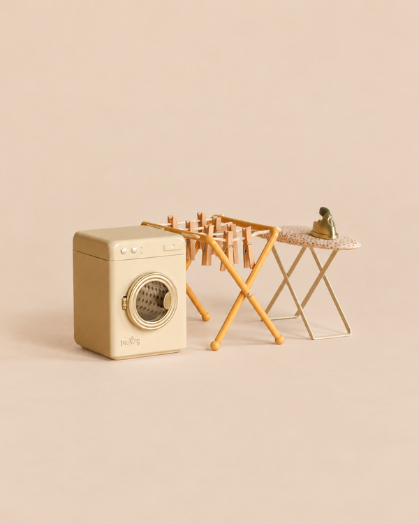 Maileg Laundry Room Set featuring a miniature washing machine, wooden drying rack with clothespins, and an ironing board with a small iron.