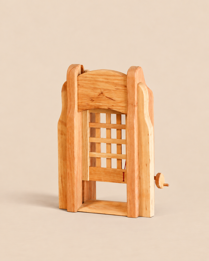 Ostheimer Portcullis handcrafted wooden toy with a sliding gate mechanism and a small side crank for imaginative play.