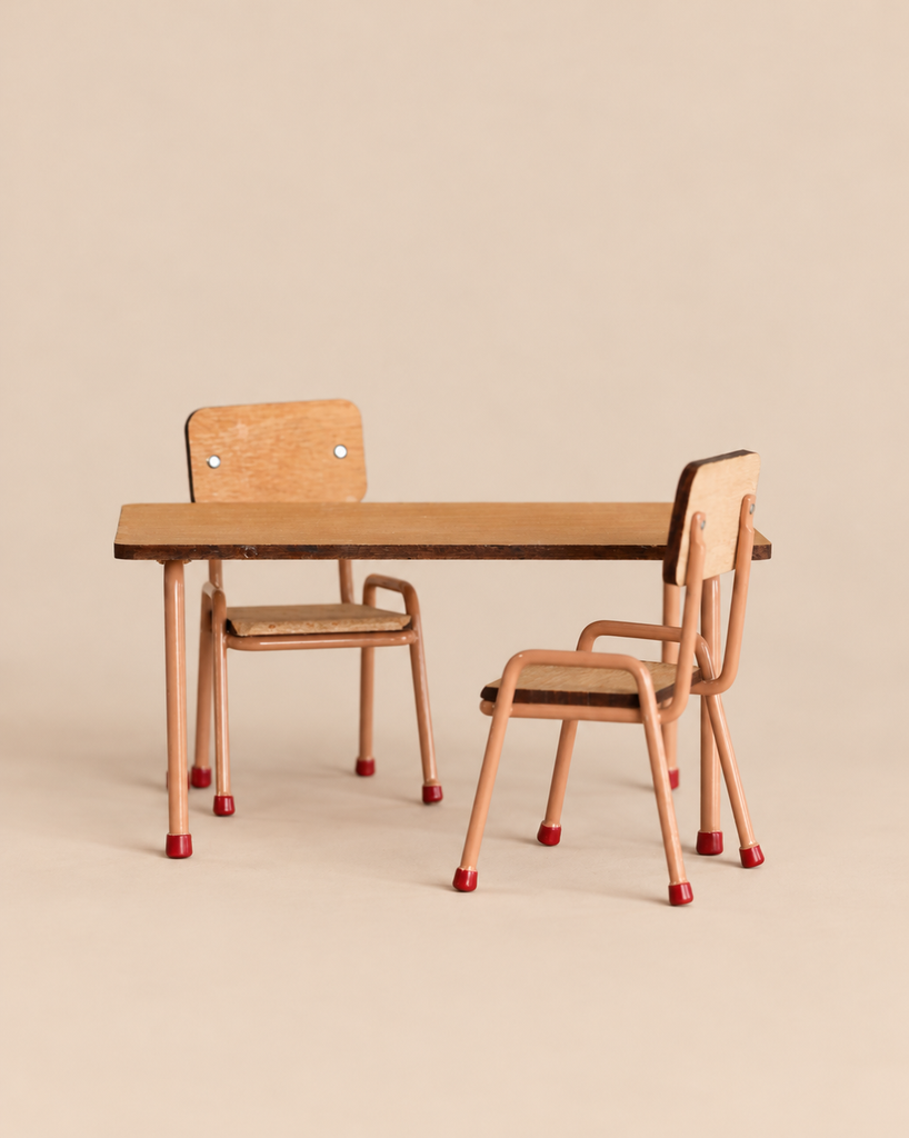 Miniature wooden Maileg Kitchen Set featuring a table with two matching chairs on a plain background.