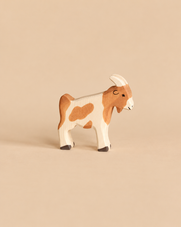 Holztiger Billy-Goat handcrafted wooden toy with brown and white markings.