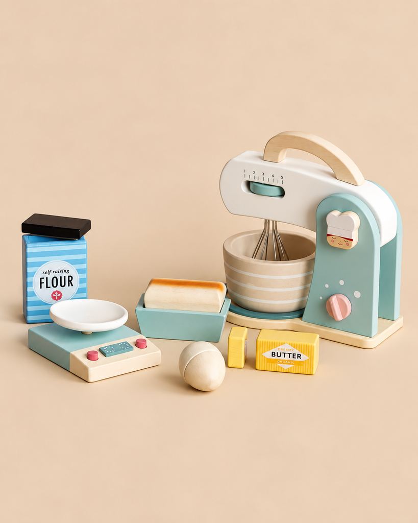 A Wooden Baking Set including a toy mixer with a bowl, a kitchen scale, a carton of flour, an egg, and blocks of butter.