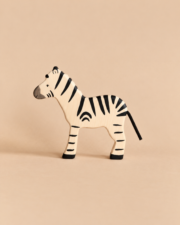 Hand-painted Holztiger Zebra wooden toy in profile.