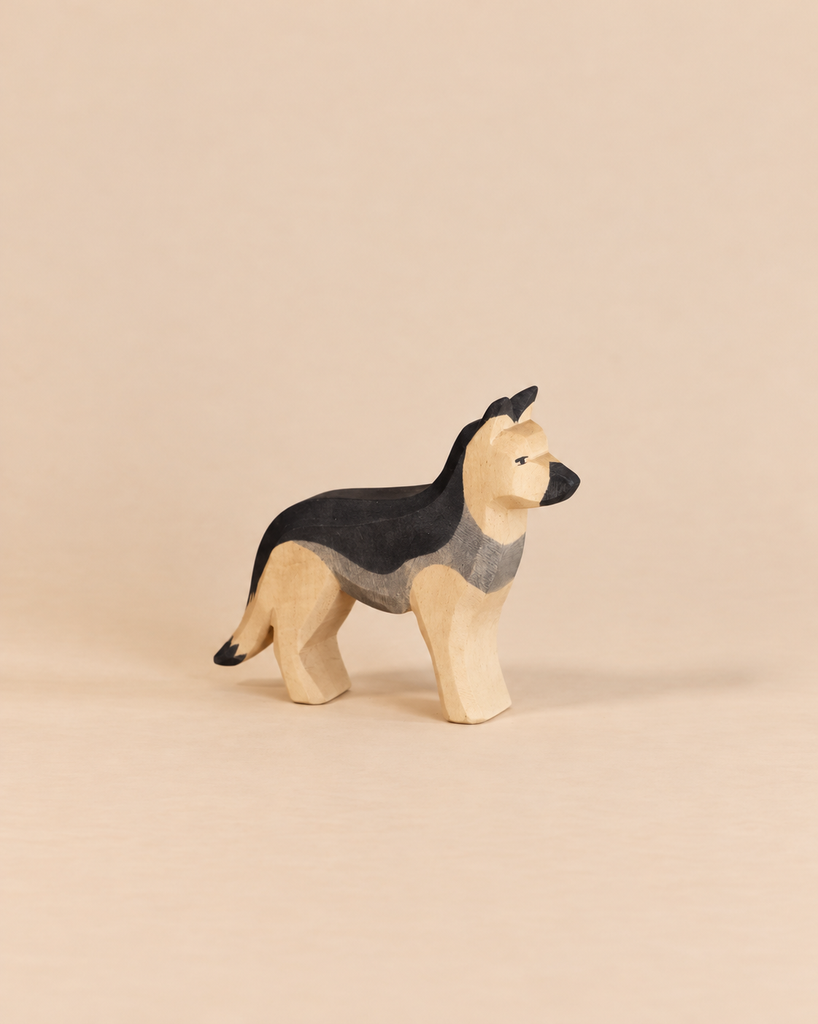 Hand-carved Ostheimer Dog - German Shepherd wooden figure with a black and tan painted finish, perfect for imaginative play.