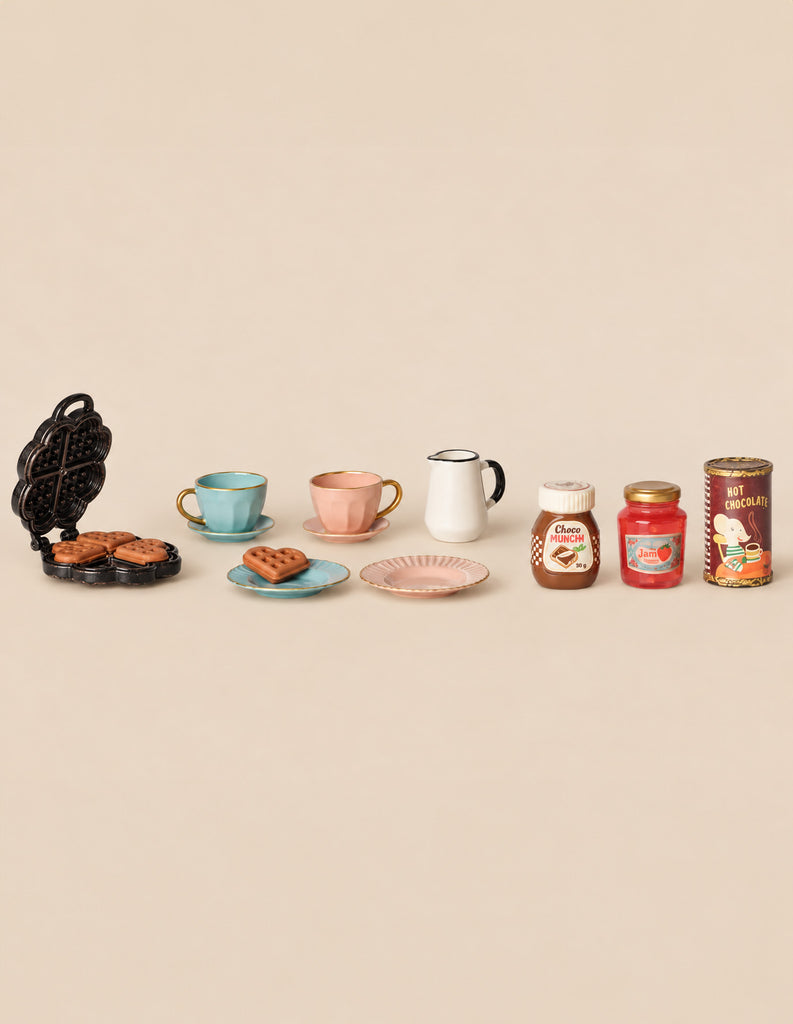 Maileg Waffle Set, Mouse, featuring a miniature toy waffle iron with heart-shaped waffles, two tea cups and saucers, a pitcher, and jars of chocolate spread, jam, and hot chocolate.