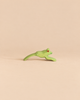 Ostheimer Jumping Frog handcrafted from wood, painted green with orange eyes in a jumping pose.