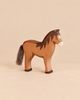 An Ostheimer Horse - Brown handcrafted wooden toy with a dark mane and a fibrous tail.