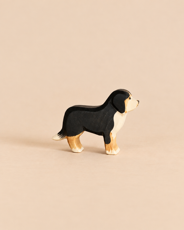 Ostheimer Dog - Bernese Mountain handcrafted wooden toy figurine with black, white, and tan markings, perfect for imaginative play.