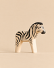 Small Handmade Holzwald Zebra figurine with painted black stripes.