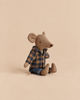 A light brown Maileg Dad Mouse In Brown Checkered Shirt sits wearing a dark blue and brown checkered shirt over blue pants.