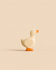 Handmade Holzwald Gosling - Baby Goose, a small wooden figurine of a goose with orange feet and beak, designed for imaginative play.