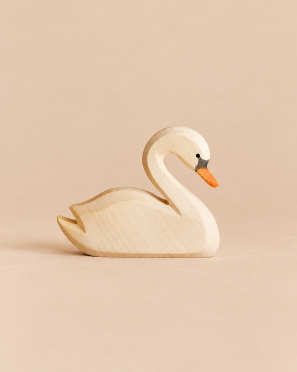 Ostheimer Swan handcrafted wooden toy with a painted orange beak and black eye detail.