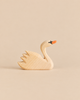 An Ostheimer Swan, Head High, handcrafted from wood with a painted orange beak and black eye detail.