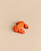 Small, orange-painted Handmade Holzwald Crab wooden toy.