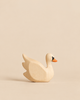 Handmade Holzwald Swan, a minimalist wooden figurine with a painted orange and black beak, designed as a sustainable toy.