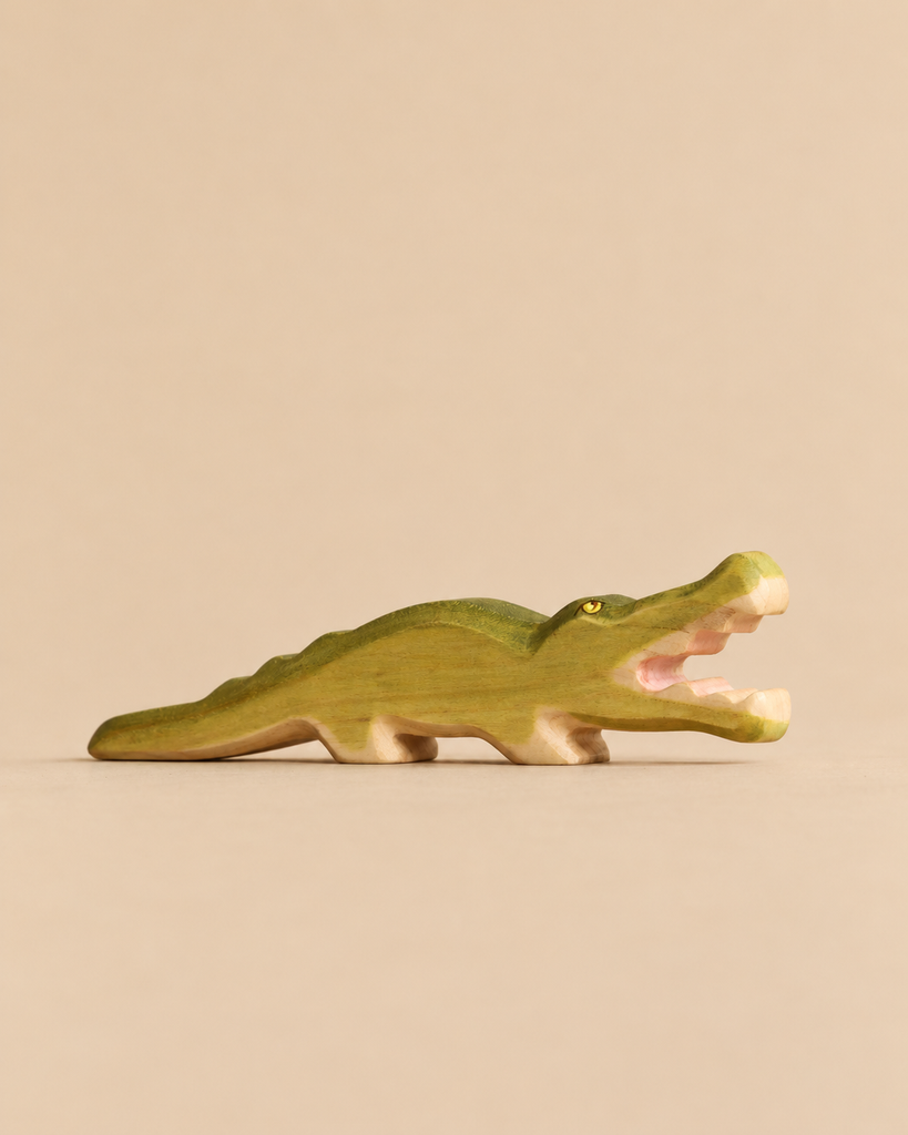 Handmade Holzwald Crocodile figurine carved from wood with a green back and open mouth, perfect for imaginative play.