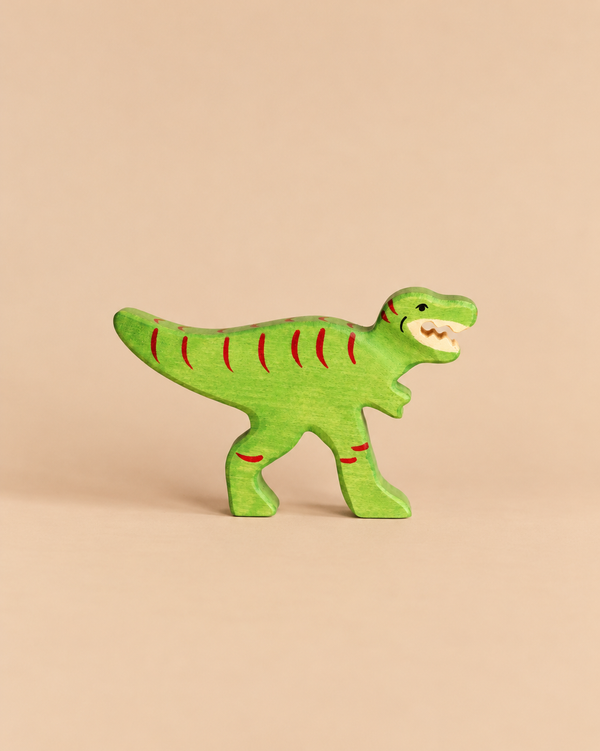 Handcrafted green Holztiger Tyrannosaurus Rex dinosaur toy with red stripe markings.