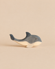 Hand-carved Ostheimer Whale toy with a blue-grey top and a natural wood underside.